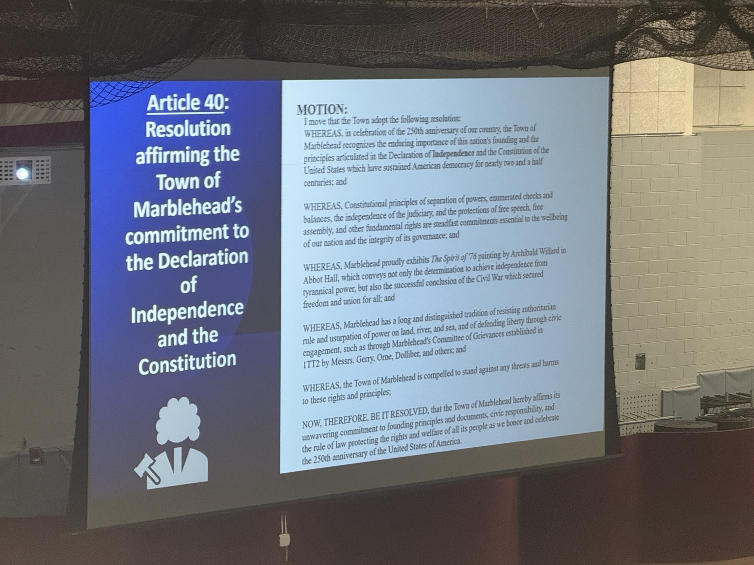 The full text of the Article 40 motion projected at the front of the Field House.