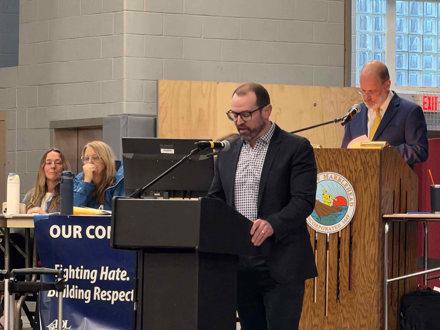 Finance Committee Chair Alec Goolsby at the lectern delivering FinCom's annual report.