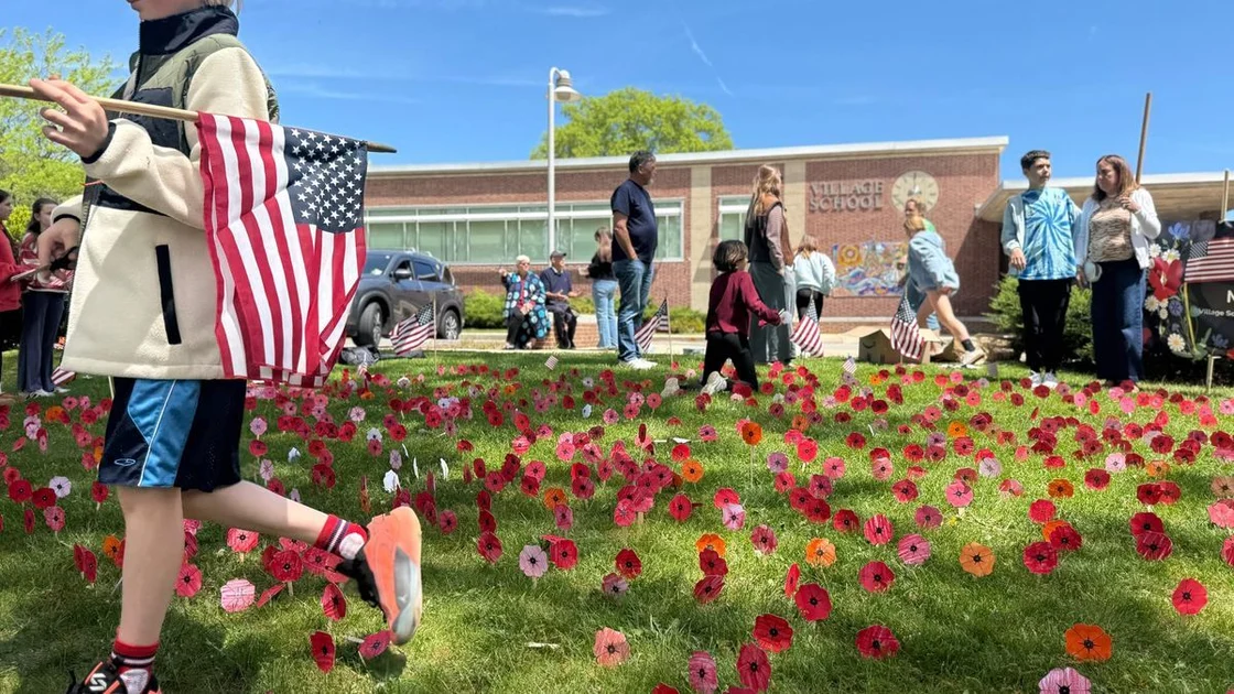 Village School children plant field of paper poppies to honor Marbleheads war dead