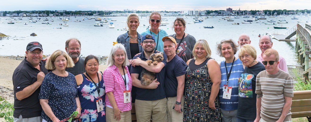 Most of the Independent news team, gathered for a group photograph at a harbor picnic.